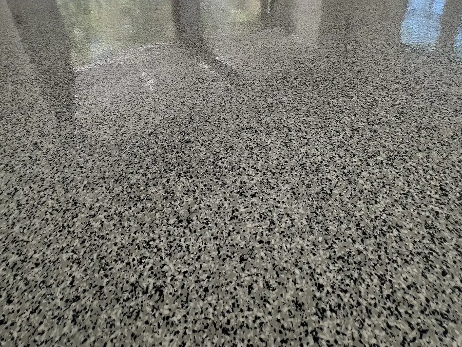 Gray and black flake garage floor with both doors open
