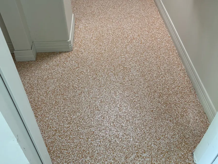 Tan and orange flake floor in an entry hall