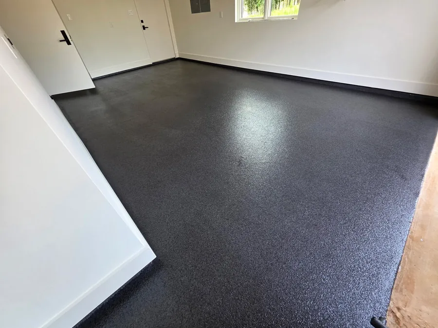 Charcoal flake garage floor beside the entry door