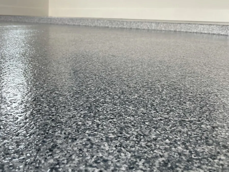 Full flake garage floor with a tool wall and a window