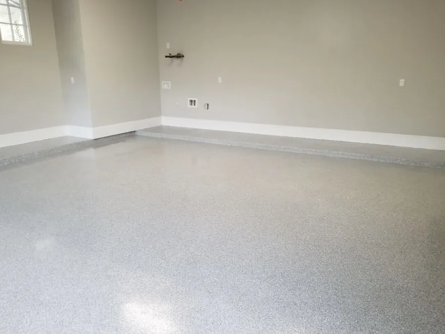 Tan flake floor in an empty two car garage