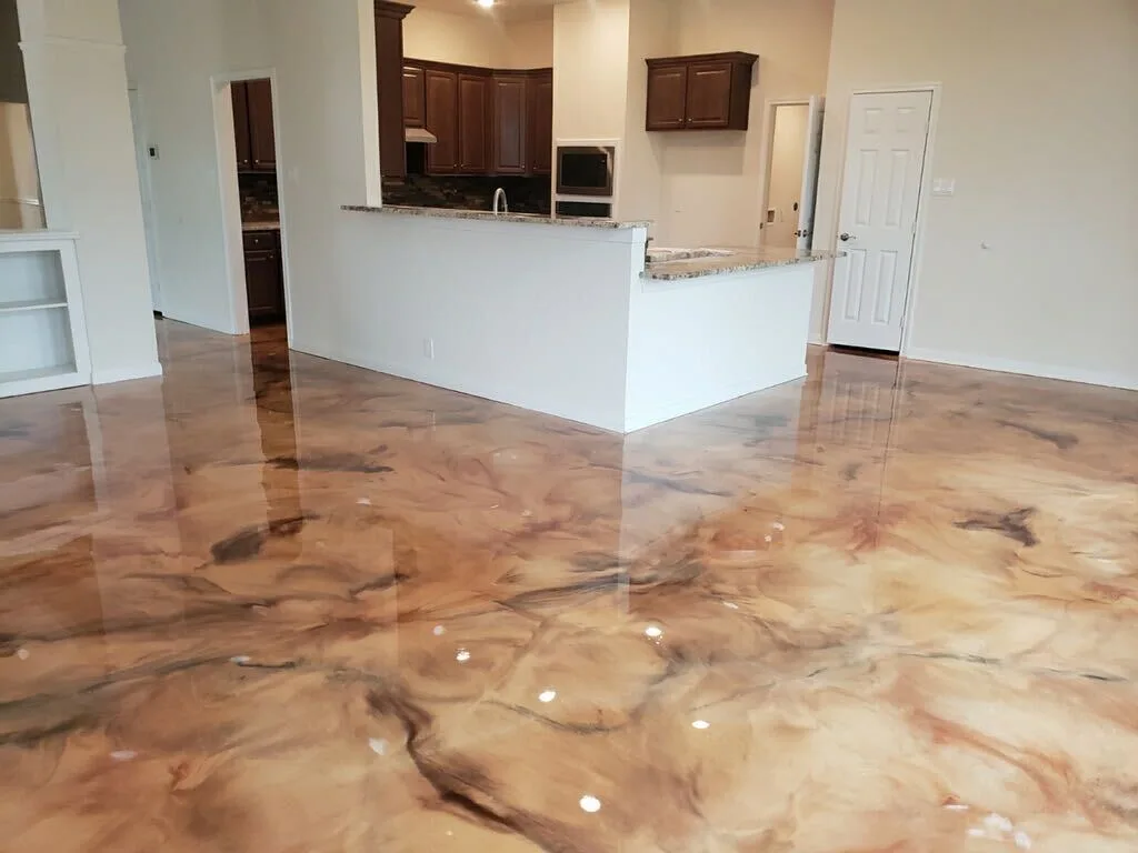 Warm copper metallic epoxy floor in a home kitchen and living area