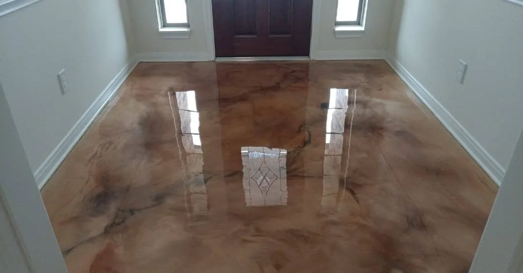Copper and cream metallic epoxy floor in a home foyer facing the front door