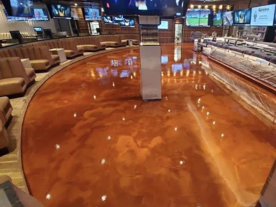 Copper metallic epoxy floor in a bar and lounge