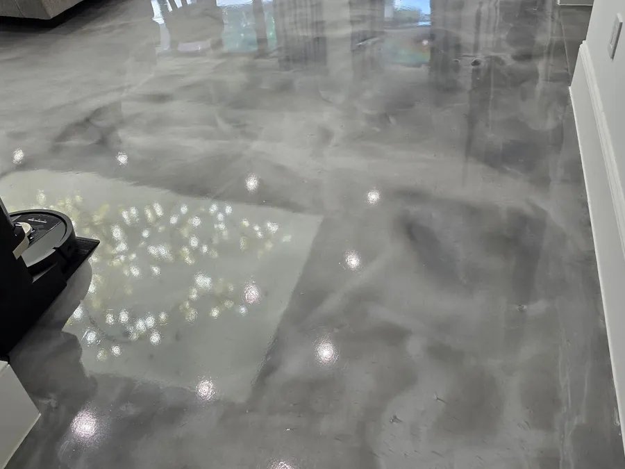 Silver and white metallic epoxy floor in a living room