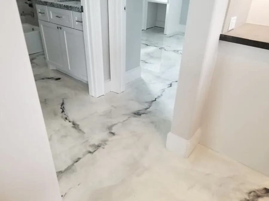 White marble look metallic epoxy floor in a home kitchen