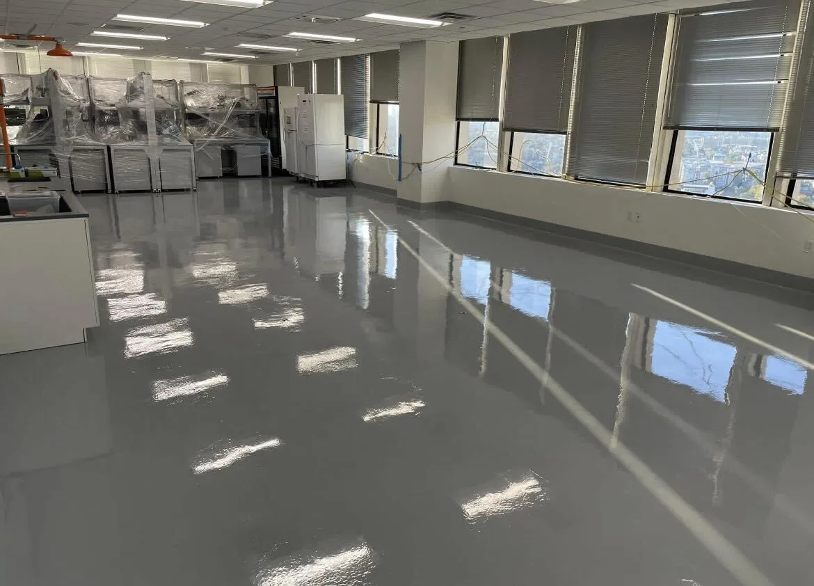 Glossy gray coated floor in a commercial lab and office space