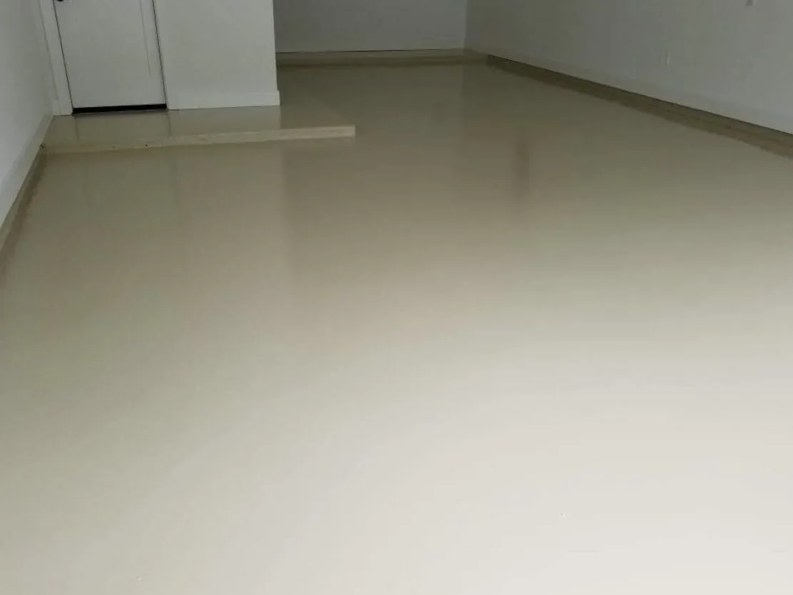 Light tan solid color epoxy floor coating in a Houston home