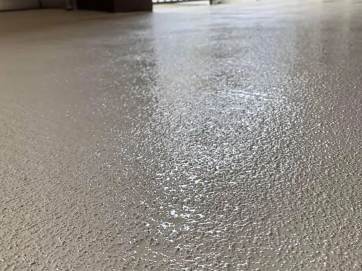 Textured walkway coating on an apartment building breezeway