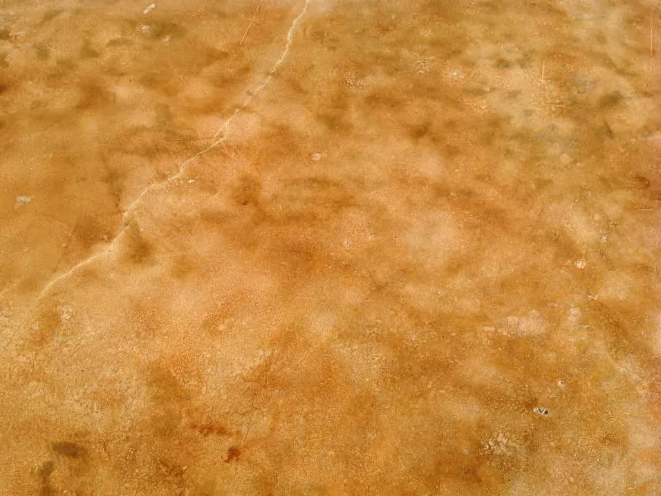 Bronze acid-stained concrete floor with a sealed finish
