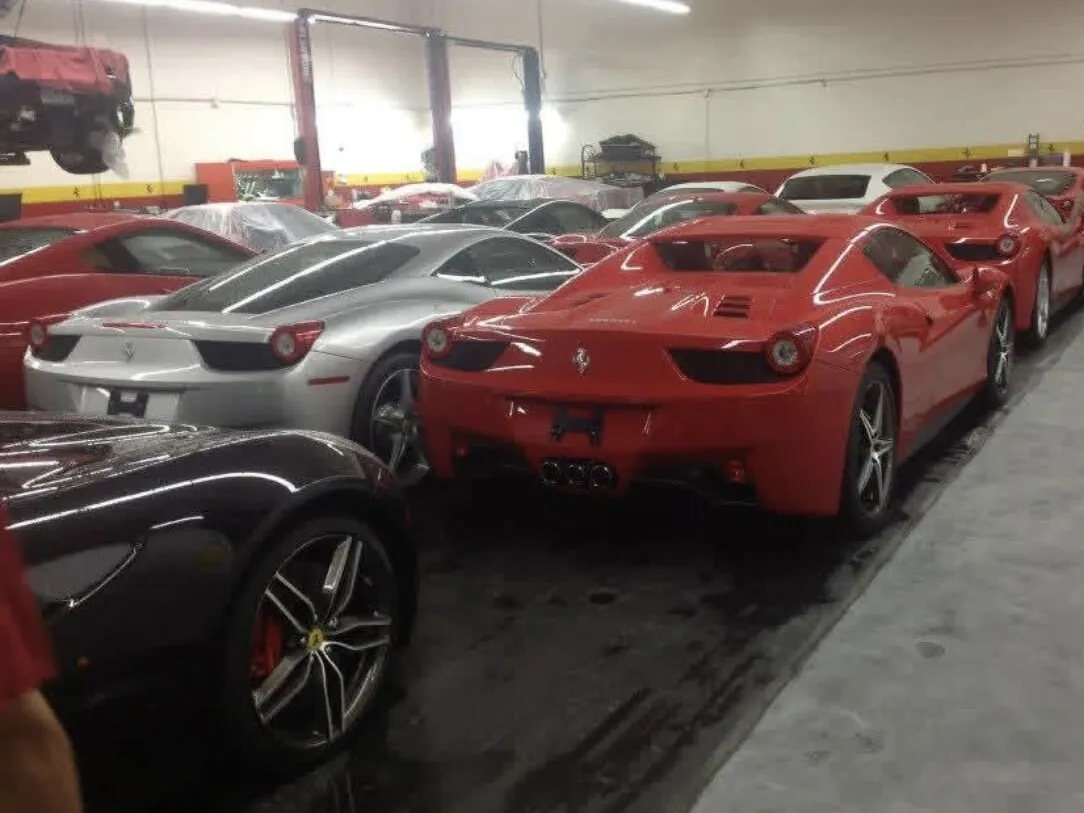 Row of Ferraris parked on the finished flake floor at the Houston dealership