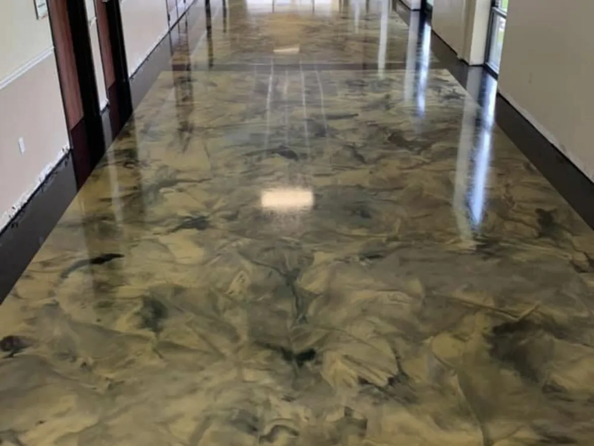 Gold and gray metallic epoxy floor down a long hallway