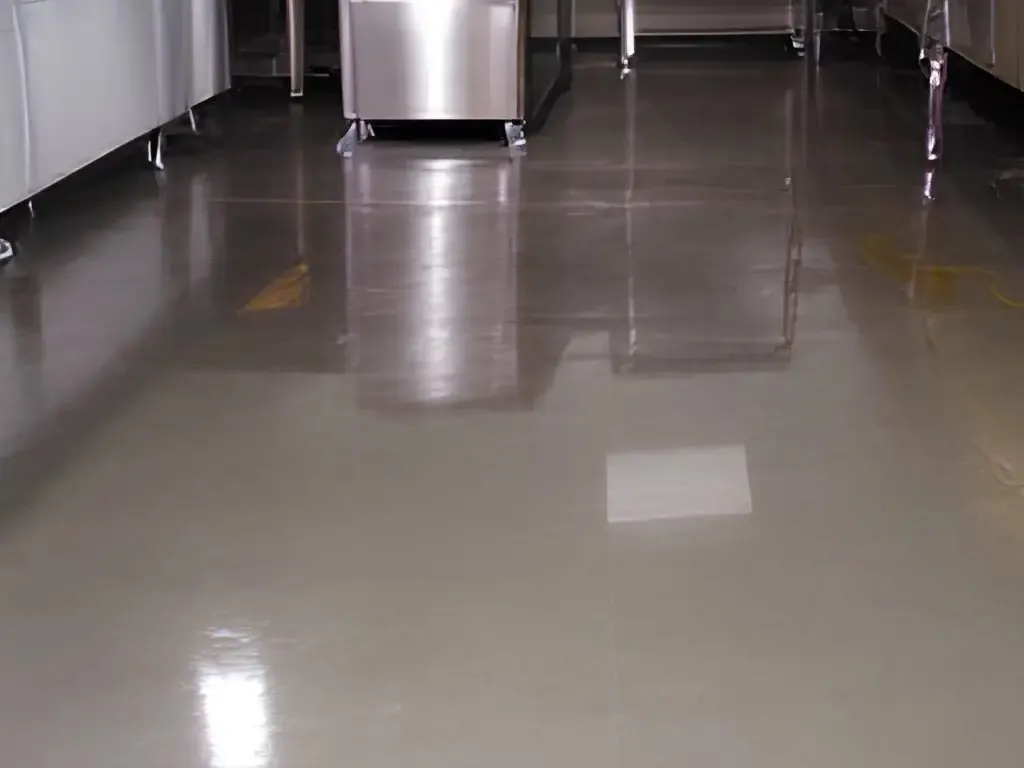 Gray coated food-prep room floor with stainless equipment