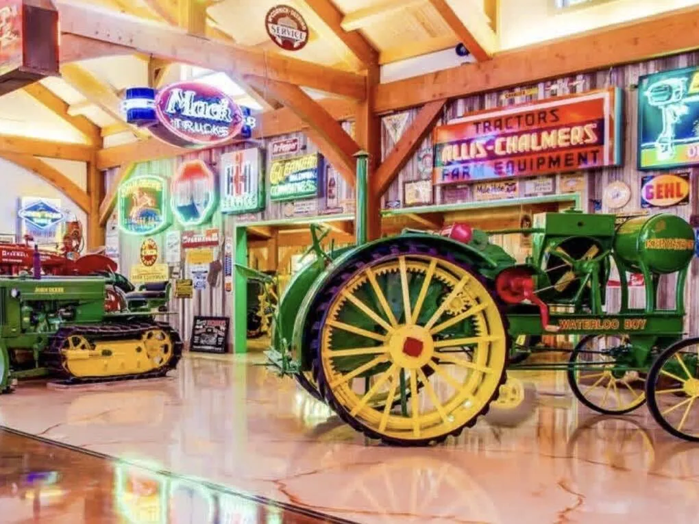 Antique tractors on the metallic epoxy floor at Hemi Hideout