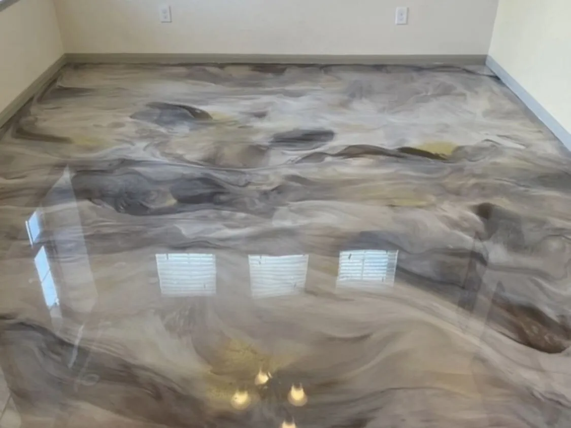 Silver and brown metallic epoxy floor in an empty room