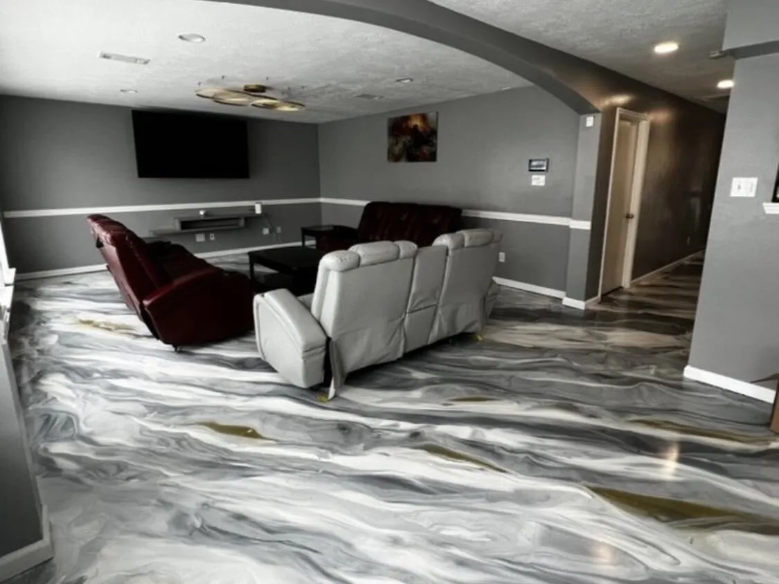 Silver and white metallic epoxy floor in a home media room